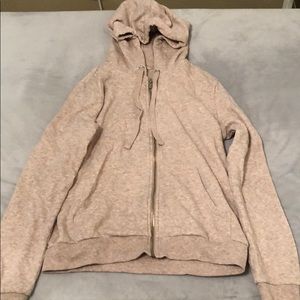 light pink h&m zip up sweatshirt with a hood